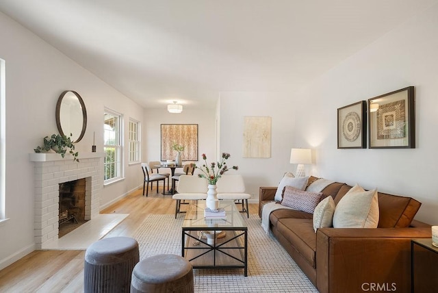 1157 Steffen St, Glendora, CA 91741 - living area featuring light wood-style floors and a fireplace