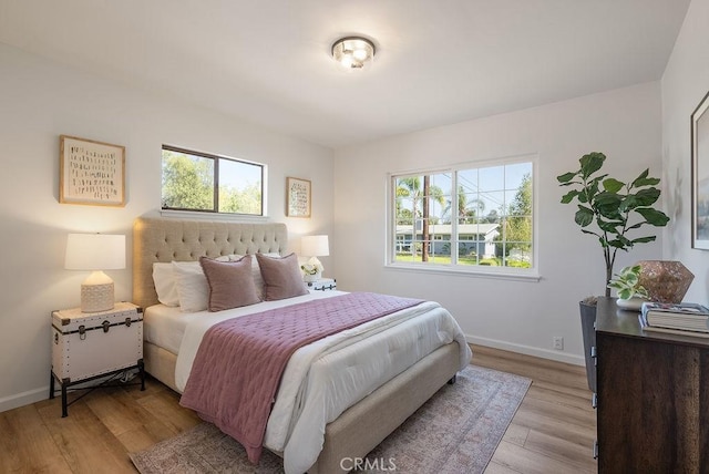 1157 Steffen St, Glendora, CA 91741 - bedroom with multiple windows and light wood-style floors
