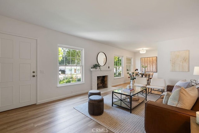 1157 Steffen St, Glendora, CA 91741 - living room featuring light wood-type flooring and a fireplace