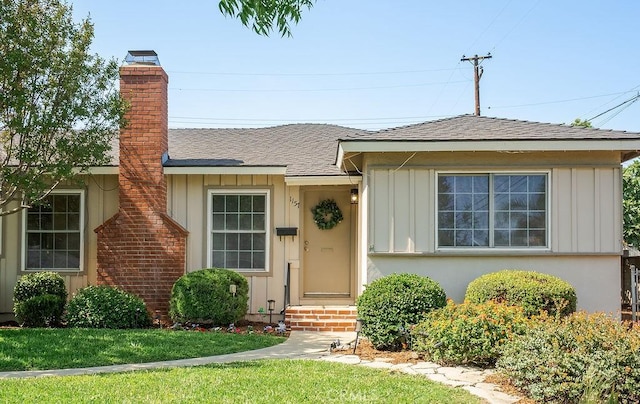 1157 Steffen St, Glendora, CA 91741 - view of front of home featuring board and batten siding, a chimney, and a shingled roof