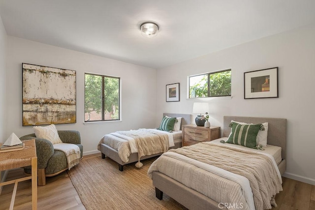 1157 Steffen St, Glendora, CA 91741 - bedroom with multiple windows and light wood-style floors