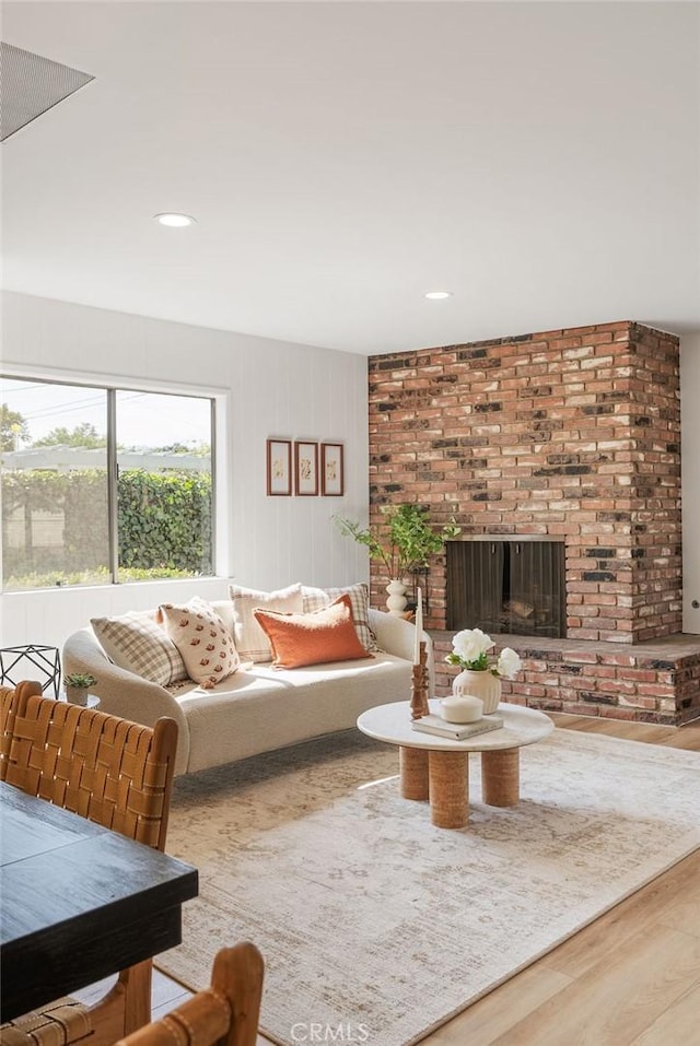 1157 Steffen St, Glendora, CA 91741 - living area with wood finished floors, a brick fireplace, and recessed lighting