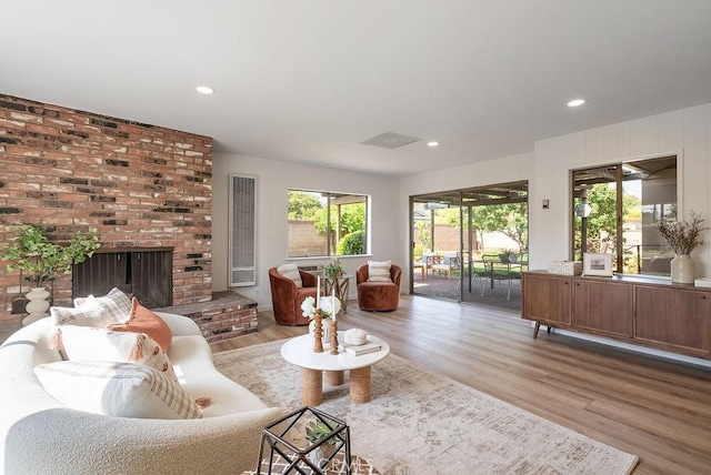 1157 Steffen St, Glendora, CA 91741 - living area with wood finished floors, a fireplace, and recessed lighting