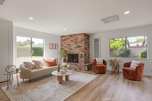 1157 Steffen St, Glendora, CA 91741 - living room featuring light wood-type flooring, a brick fireplace, and recessed lighting