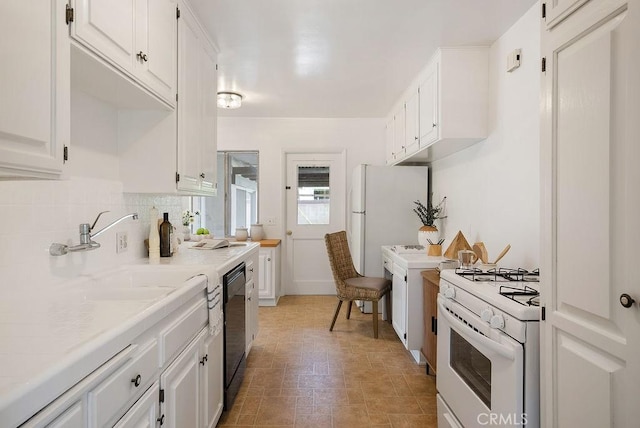1157 Steffen St, Glendora, CA 91741 - kitchen with white gas stove, light countertops, white cabinets, dishwasher, and decorative backsplash
