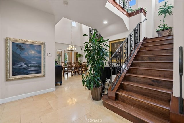 1377 Versante Cir, Corona, CA 92881 - stairs with a high ceiling, a chandelier, plenty of natural light, tile patterned floors, and recessed lighting