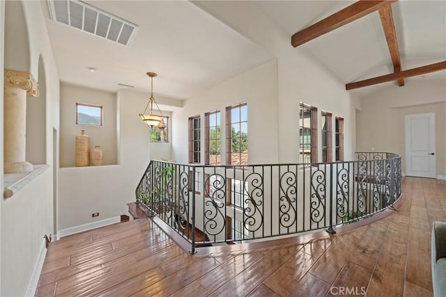 1377 Versante Cir, Corona, CA 92881 - hallway featuring an upstairs landing, wood-type flooring, and arched walkways