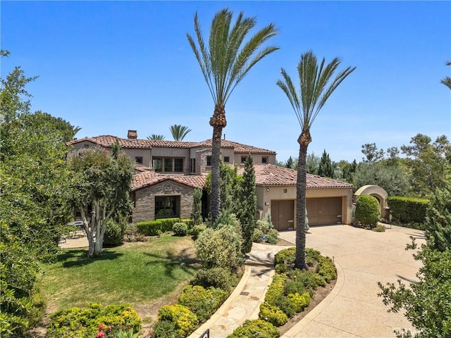 1377 Versante Cir, Corona, CA 92881 - mediterranean / spanish home with an attached garage, a chimney, a tile roof, concrete driveway, and stucco siding