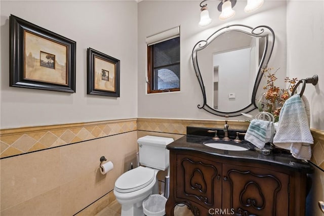1377 Versante Cir, Corona, CA 92881 - half bath featuring tile walls, vanity, wainscoting, and tile patterned flooring