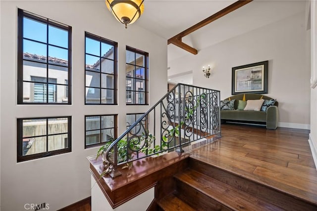 1377 Versante Cir, Corona, CA 92881 - stairs with wood finished floors and beamed ceiling