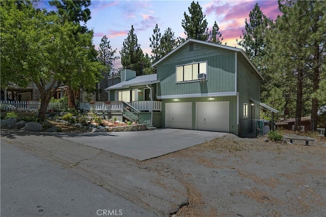 1876 Sparrow Rd, Wrightwood, CA 92397 - tri-level home with a garage, driveway, and covered porch