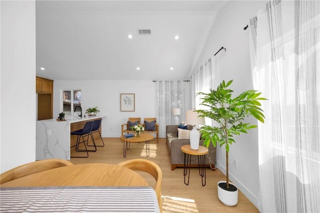 351 Vista Pl, Los Angeles, CA 90042 - living area with light wood-style floors, vaulted ceiling, and recessed lighting