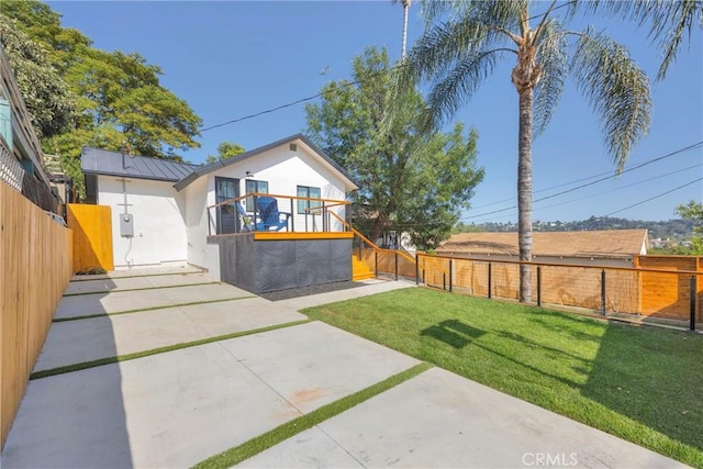 351 Vista Pl, Los Angeles, CA 90042 - view of front of property featuring stucco siding, a fenced backyard, a patio area, a standing seam roof, and a metal roof