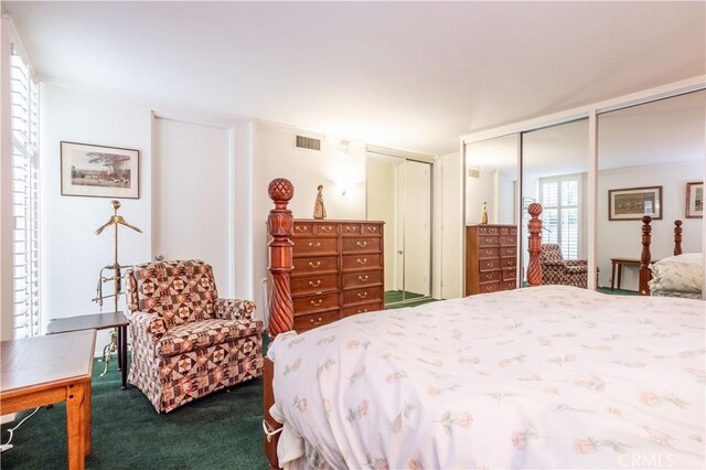 740 S Orange Grove Blvd Unit 7, Pasadena, CA 91105 - bedroom featuring dark colored carpet and multiple closets