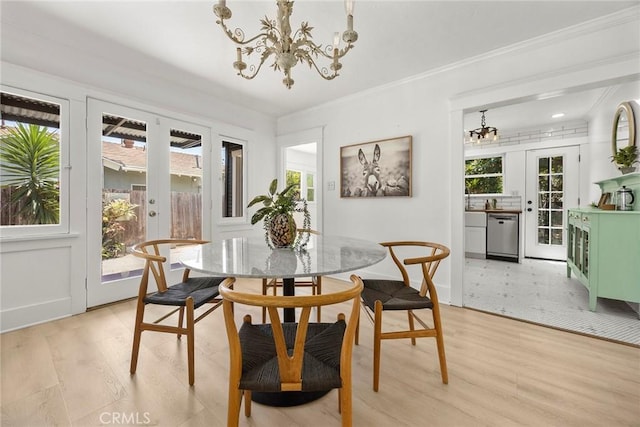 1111 Dawson Ave, Long Beach, CA 90804 - dining area with a chandelier, light wood-type flooring, french doors, and ornamental molding