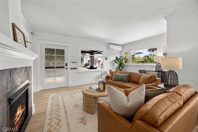 1111 Dawson Ave, Long Beach, CA 90804 - living room with ornamental molding, a fireplace, an AC wall unit, and light wood-type flooring