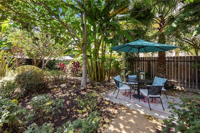 1111 Dawson Ave, Long Beach, CA 90804 - fenced backyard featuring a patio and outdoor dining area