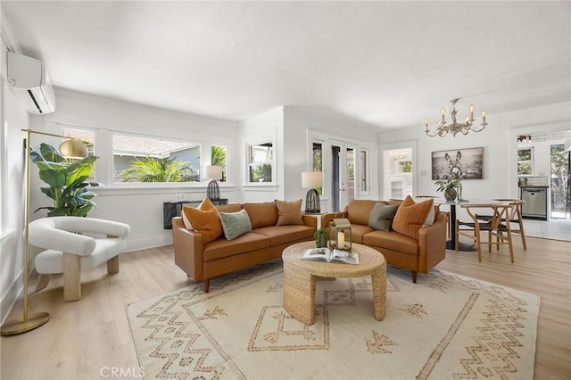 1111 Dawson Ave, Long Beach, CA 90804 - living room featuring a chandelier, light wood-style floors, and a wall unit AC