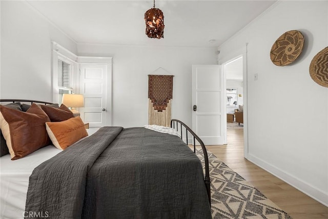 1111 Dawson Ave, Long Beach, CA 90804 - bedroom with light wood-style floors and ornamental molding