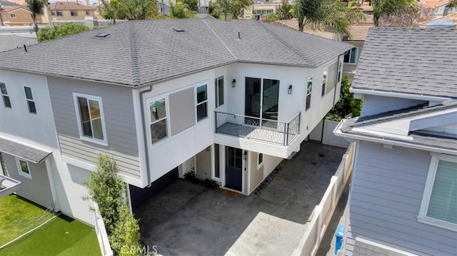 2117 Marshallfield Ln Unit B, Redondo Beach, CA 90278 - back of house featuring roof with shingles, a residential view, and stucco siding