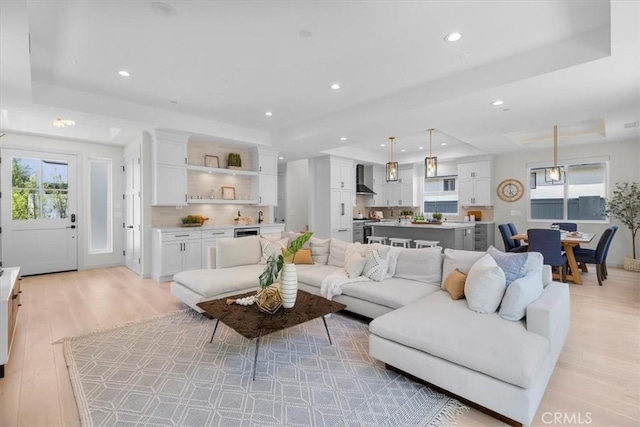 2117 Marshallfield Ln Unit B, Redondo Beach, CA 90278 - living area featuring a raised ceiling, light wood finished floors, and recessed lighting
