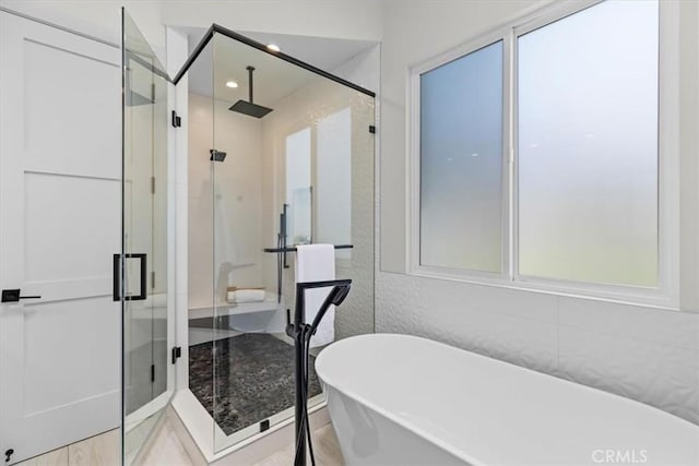 2117 Marshallfield Ln Unit B, Redondo Beach, CA 90278 - full bath featuring a shower stall, a freestanding tub, and healthy amount of natural light