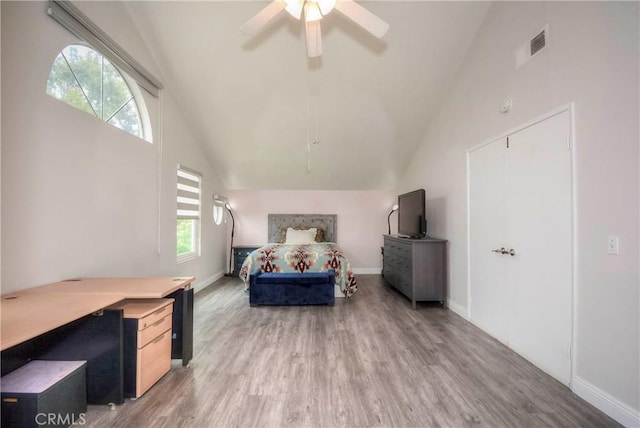 7008 Davenport Ct, Rancho Cucamonga, CA 91701 - bedroom featuring light wood-type flooring, multiple windows, ceiling fan, and high vaulted ceiling
