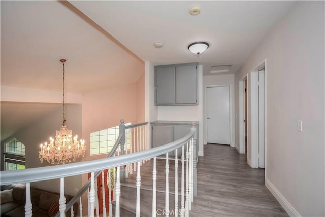 7008 Davenport Ct, Rancho Cucamonga, CA 91701 - hallway featuring a chandelier, an upstairs landing, and wood finished floors