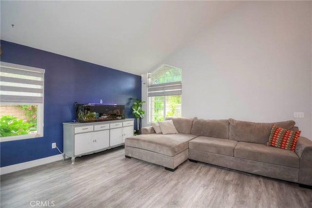 7008 Davenport Ct, Rancho Cucamonga, CA 91701 - living area with light wood-type flooring and high vaulted ceiling