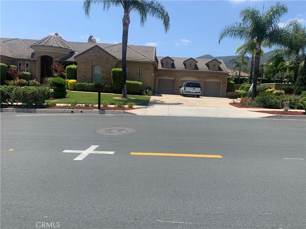 1180 Cleveland Way, Corona, CA 92881 - view of front of property featuring a garage, driveway, and a tile roof