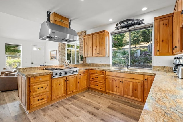 26380 San Felipe Rd, Warner Springs, CA 92086 - kitchen featuring exhaust hood, stainless steel gas cooktop, a peninsula, light wood finished floors, and recessed lighting