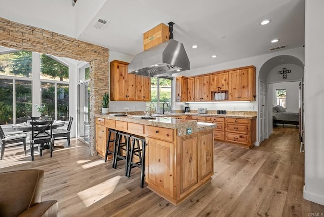 26380 San Felipe Rd, Warner Springs, CA 92086 - kitchen featuring island exhaust hood, light wood-style flooring, plenty of natural light, a peninsula, and recessed lighting