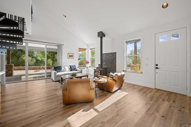 26380 San Felipe Rd, Warner Springs, CA 92086 - living area with a wood stove, plenty of natural light, high vaulted ceiling, light wood-style floors, and recessed lighting