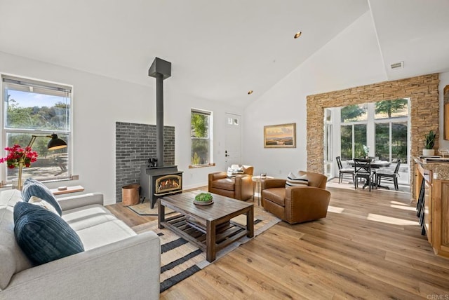 26380 San Felipe Rd, Warner Springs, CA 92086 - living room featuring a wood stove, high vaulted ceiling, and light wood-style flooring