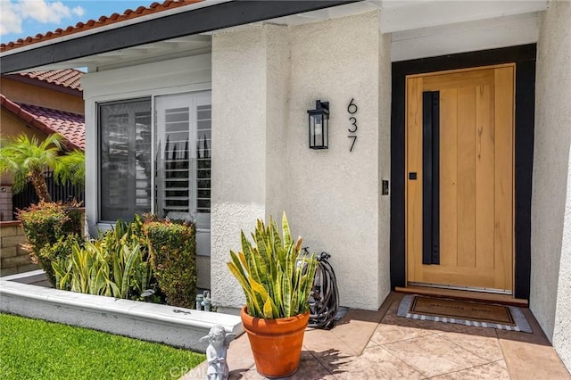 637 Silver Bridle Rd, Walnut, CA 91789 - doorway to property with stucco siding, elevator, and a tile roof