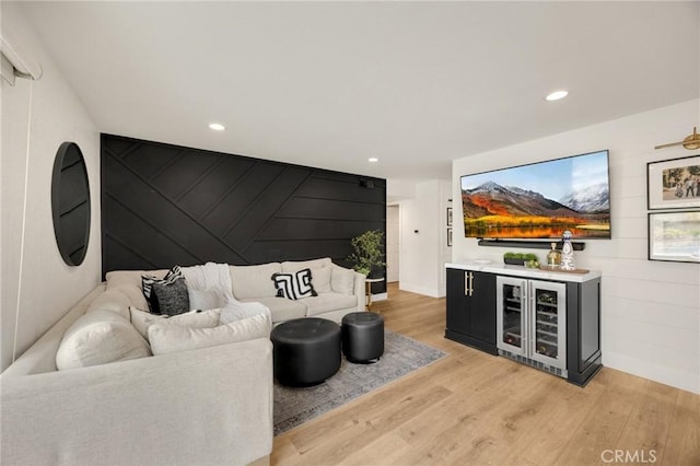 637 Silver Bridle Rd, Walnut, CA 91789 - living area with wine cooler, light wood finished floors, a bar, recessed lighting, and an accent wall