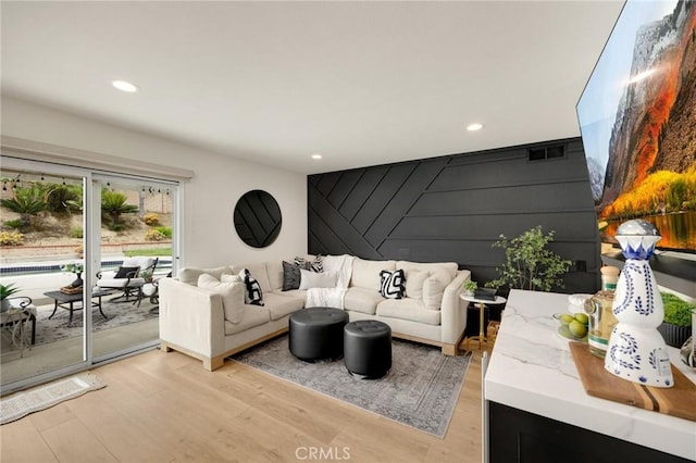 637 Silver Bridle Rd, Walnut, CA 91789 - living room featuring an accent wall, recessed lighting, and light wood finished floors