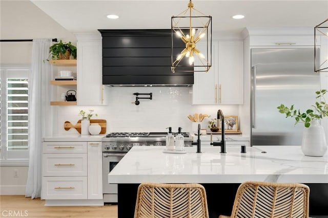 637 Silver Bridle Rd, Walnut, CA 91789 - kitchen with stainless steel appliances, ventilation hood, white cabinets, backsplash, and open shelves