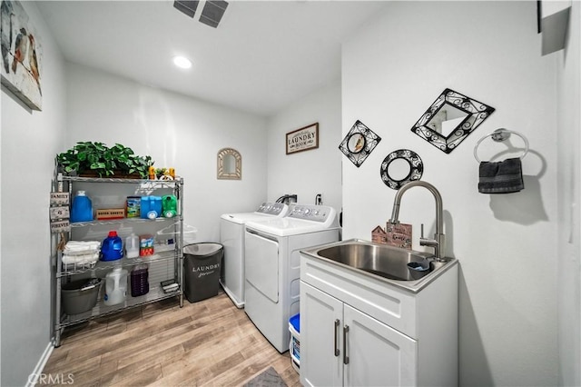 14160 Hercules St, Hesperia, CA 92345 - laundry area with washing machine and clothes dryer, light wood-style flooring, and recessed lighting