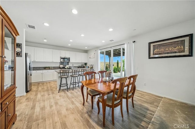 14160 Hercules St, Hesperia, CA 92345 - dining space featuring light wood-type flooring and recessed lighting