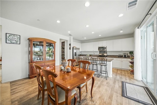 14160 Hercules St, Hesperia, CA 92345 - dining area with light wood finished floors and recessed lighting