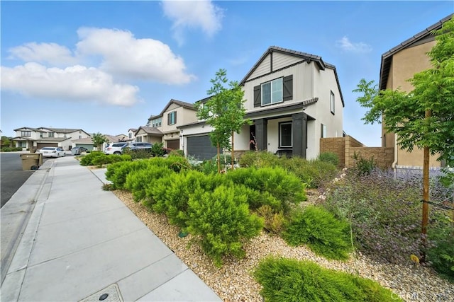 14160 Hercules St, Hesperia, CA 92345 - view of front facade with stucco siding, a garage, and a residential view