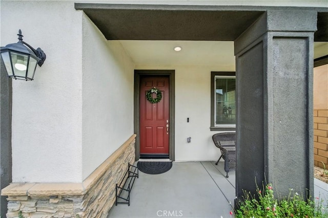 14160 Hercules St, Hesperia, CA 92345 - doorway to property featuring stucco siding