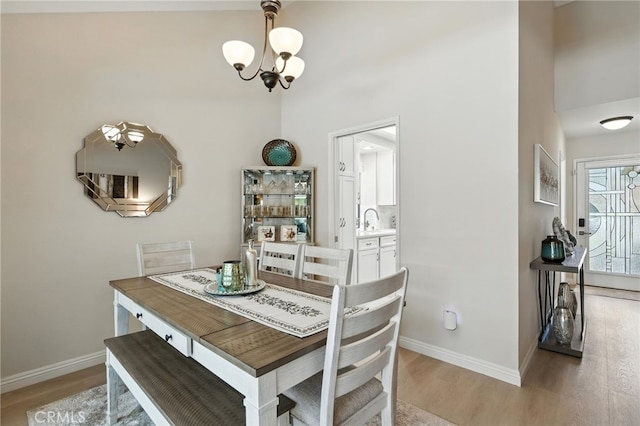 7178 Tangerine Pl, Rancho Cucamonga, CA 91701 - dining area featuring a chandelier and light wood-style floors