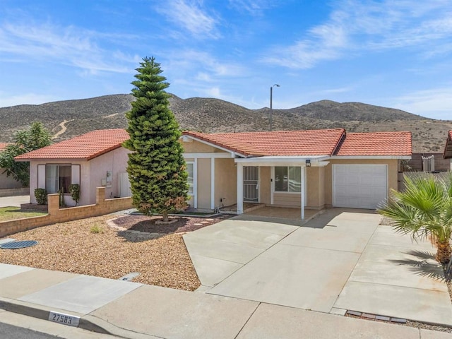 27583 Genevieve Dr, Menifee, CA 92586 - mediterranean / spanish home with a mountain view, a garage, and a tile roof