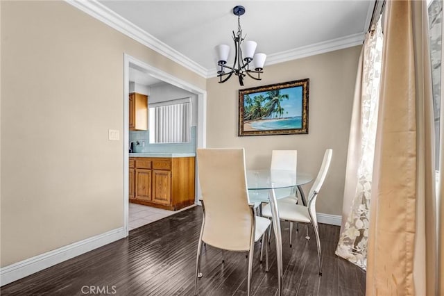 17959 Cantara St, Reseda, CA 91335 - dining space featuring a chandelier, light wood-style flooring, and crown molding