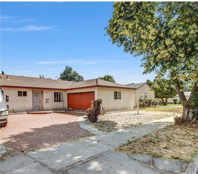 17959 Cantara St, Reseda, CA 91335 - ranch-style home with stucco siding and an attached garage