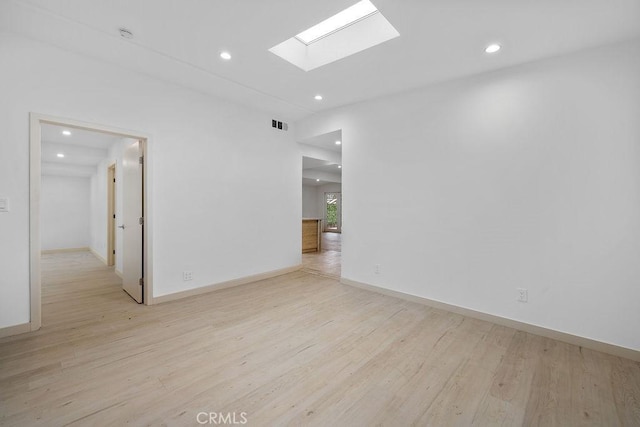 18720 Keswick St, Reseda, CA 91335 - empty room with recessed lighting, light wood finished floors, and a skylight