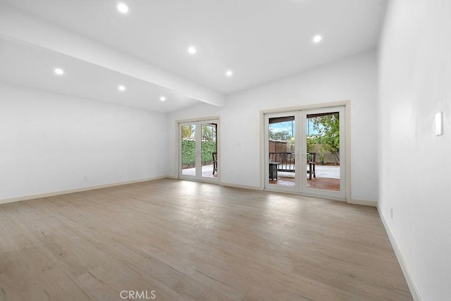 18720 Keswick St, Reseda, CA 91335 - empty room featuring vaulted ceiling, french doors, recessed lighting, and light wood-style floors