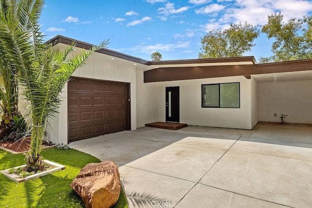 18720 Keswick St, Reseda, CA 91335 - view of front of house with an attached garage, driveway, and stucco siding